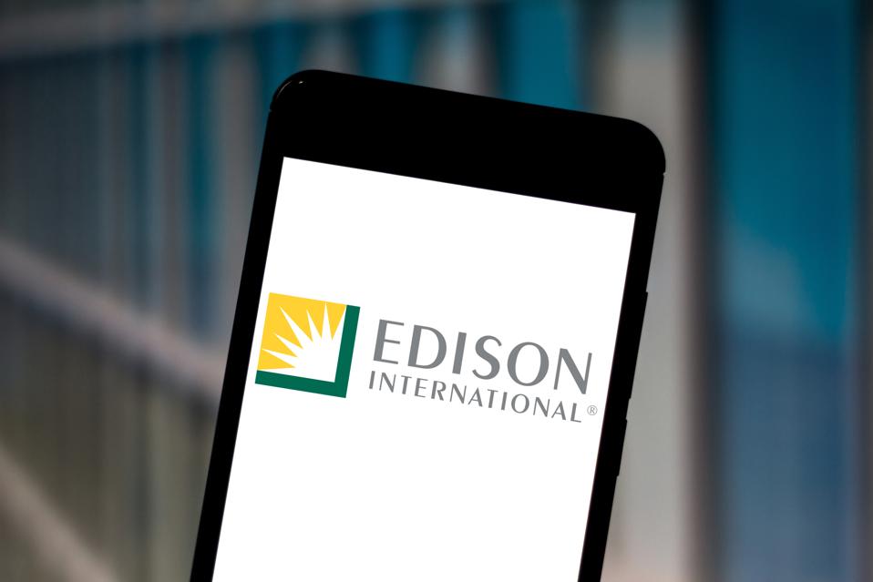 In this photo illustration a Edison International logo seen...