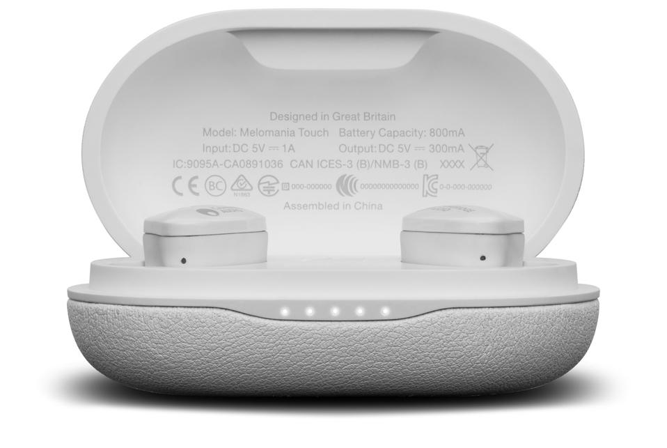 White Melomania earbuds in their charging case showing five illuminated LEDs