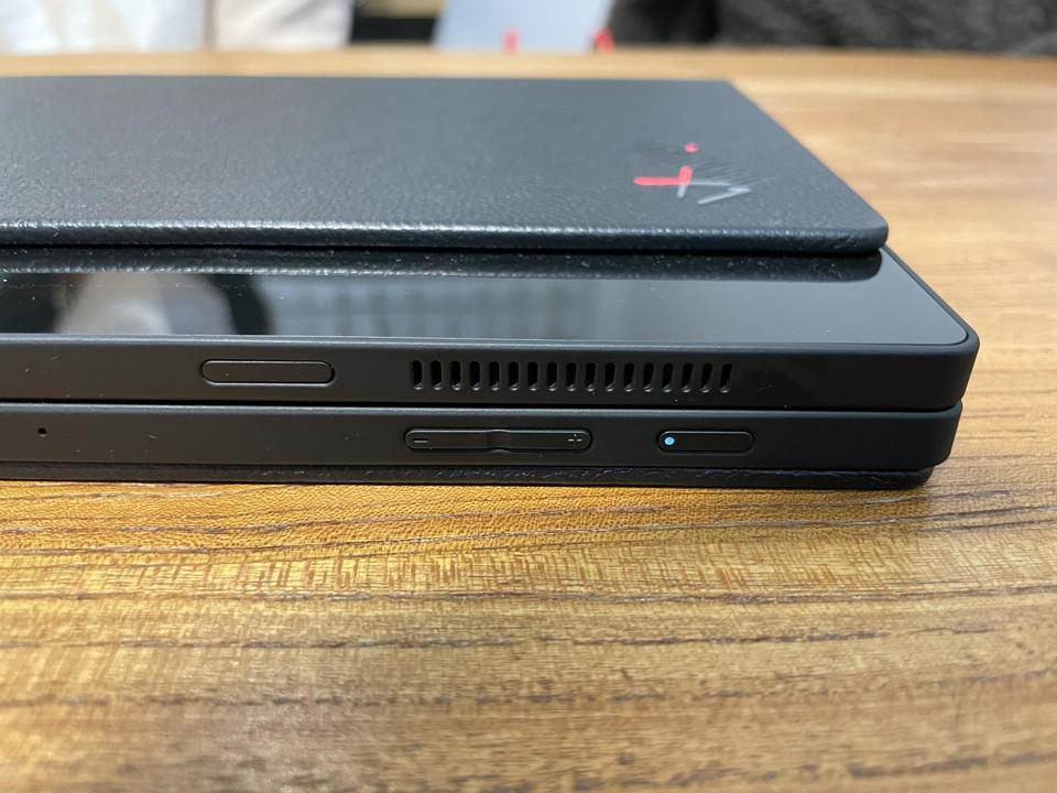 The tablet has a non-removable leather back cover.