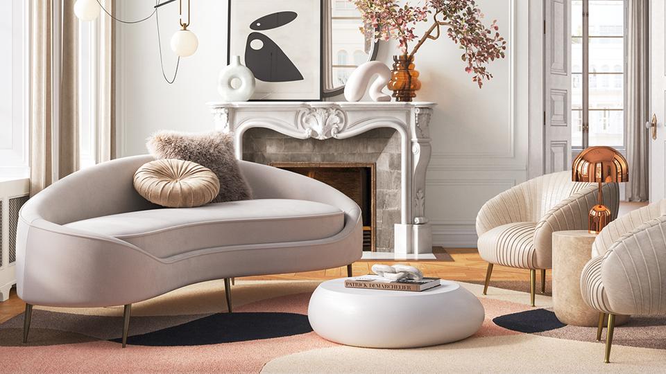 a curved sofa in a living room with a fireplace