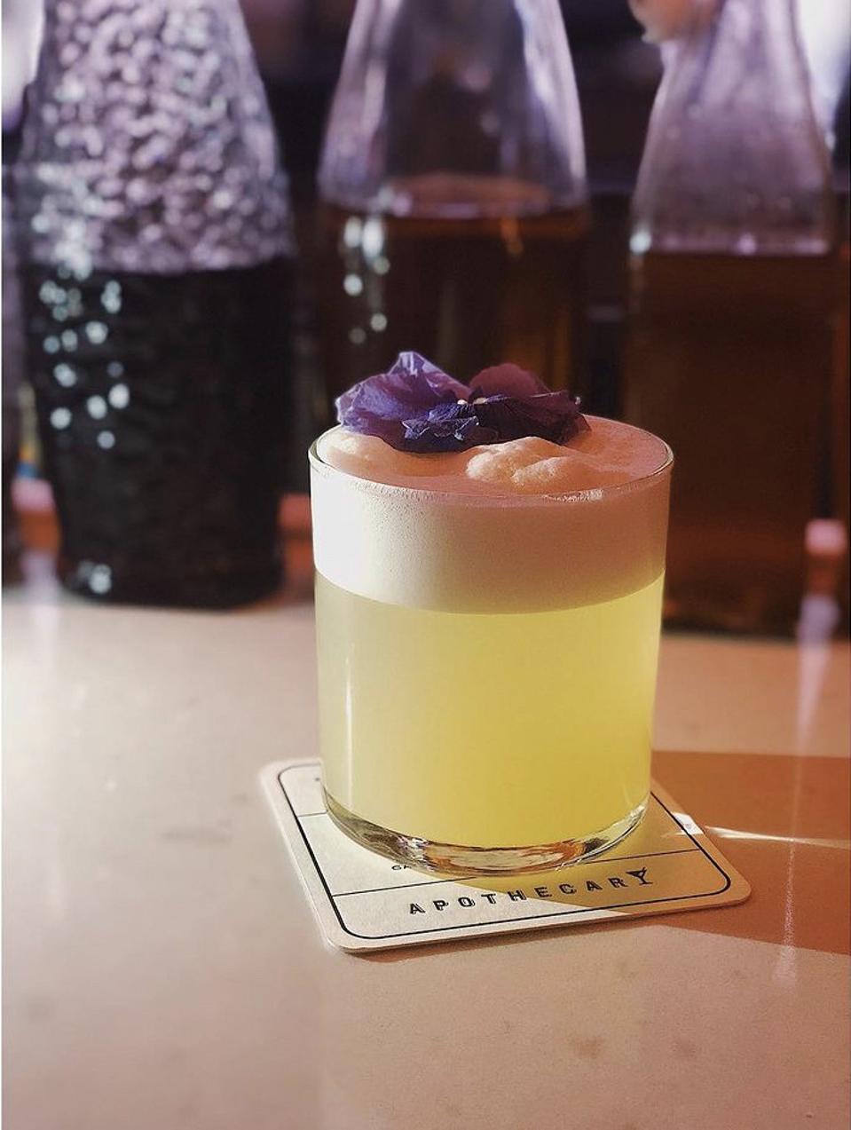 Champagne cocktail on a coaster.