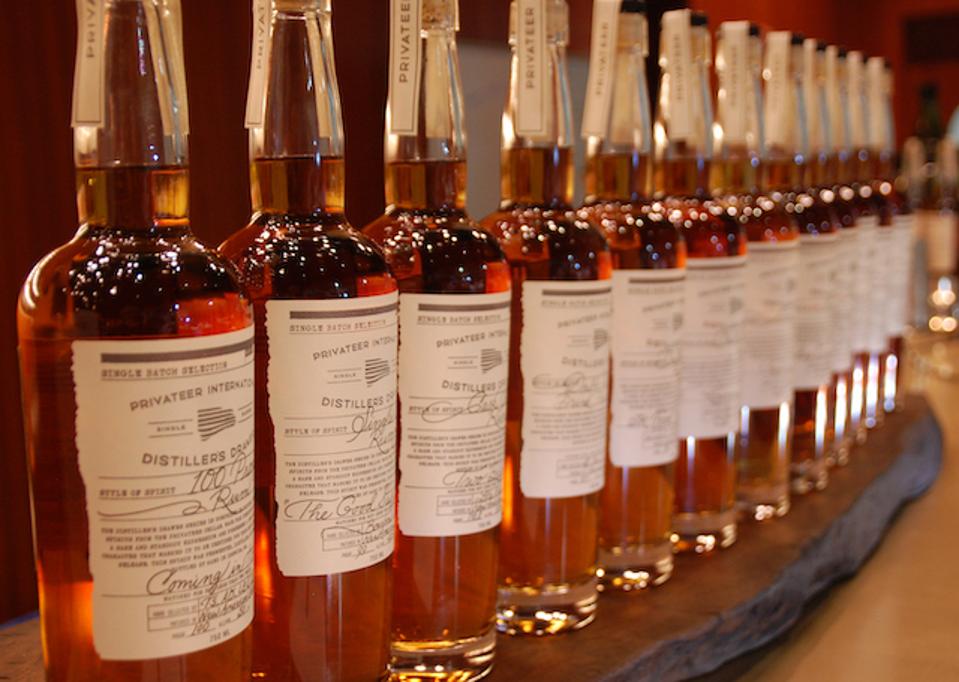 Bottles of rum lined up on a bar