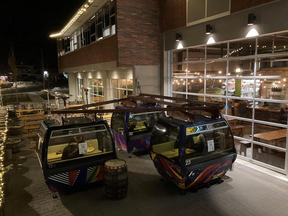 Three gondolas used as tables at a brewery