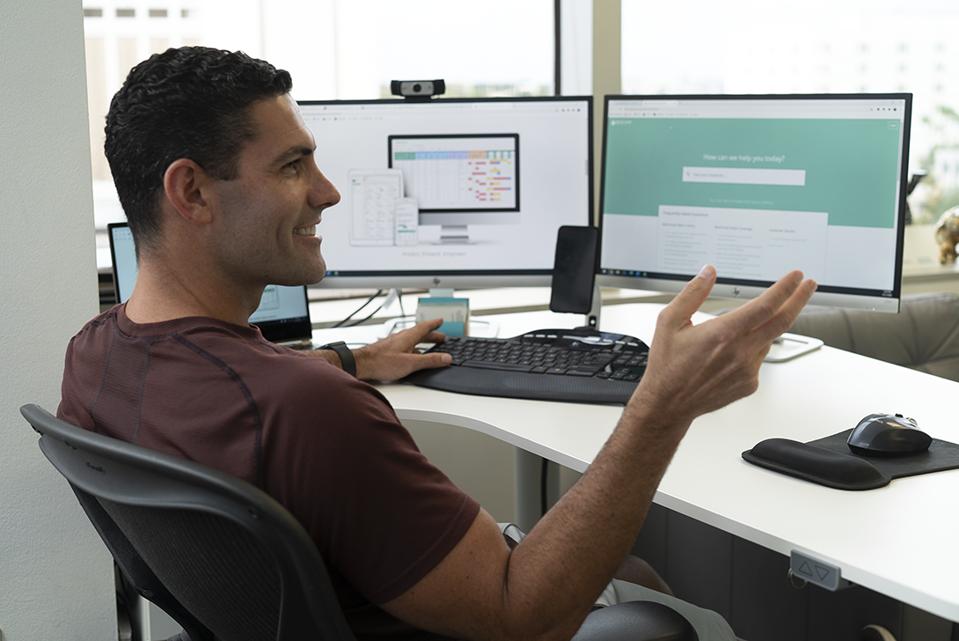 man sitting at computer