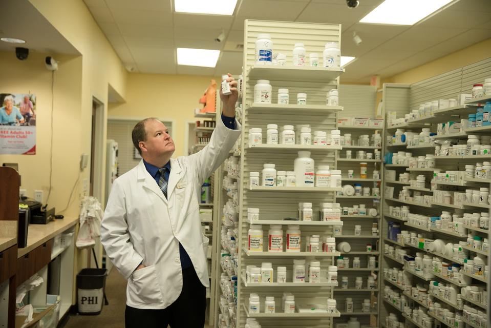pharmacist picking medicine