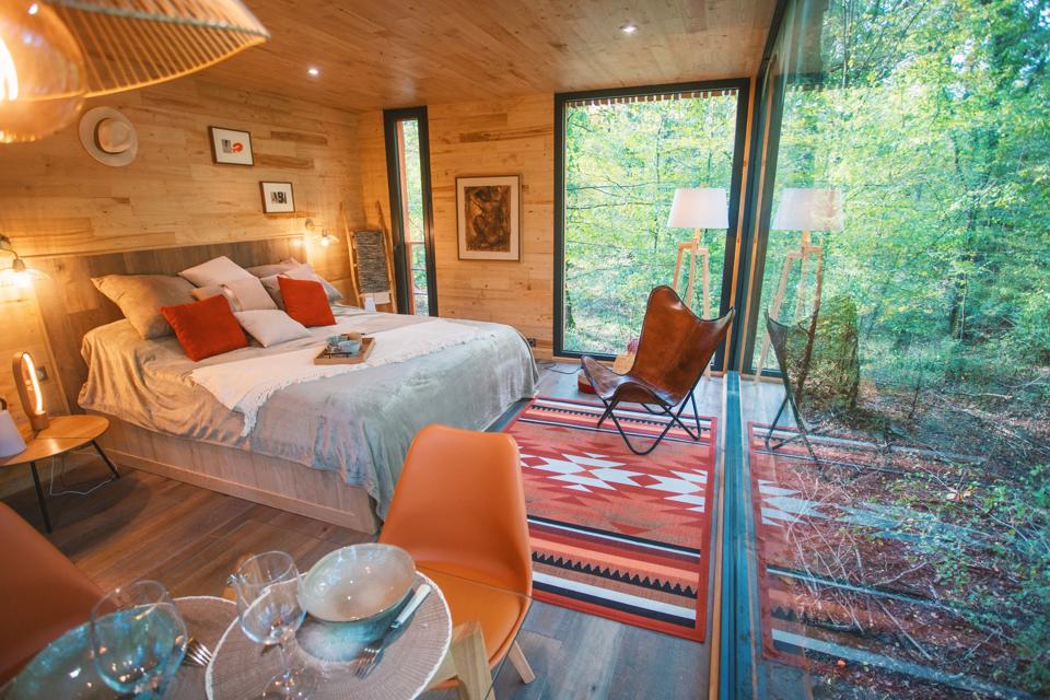 A tree house at Loire Valley Lodges in France is decorated with bright colors and art.