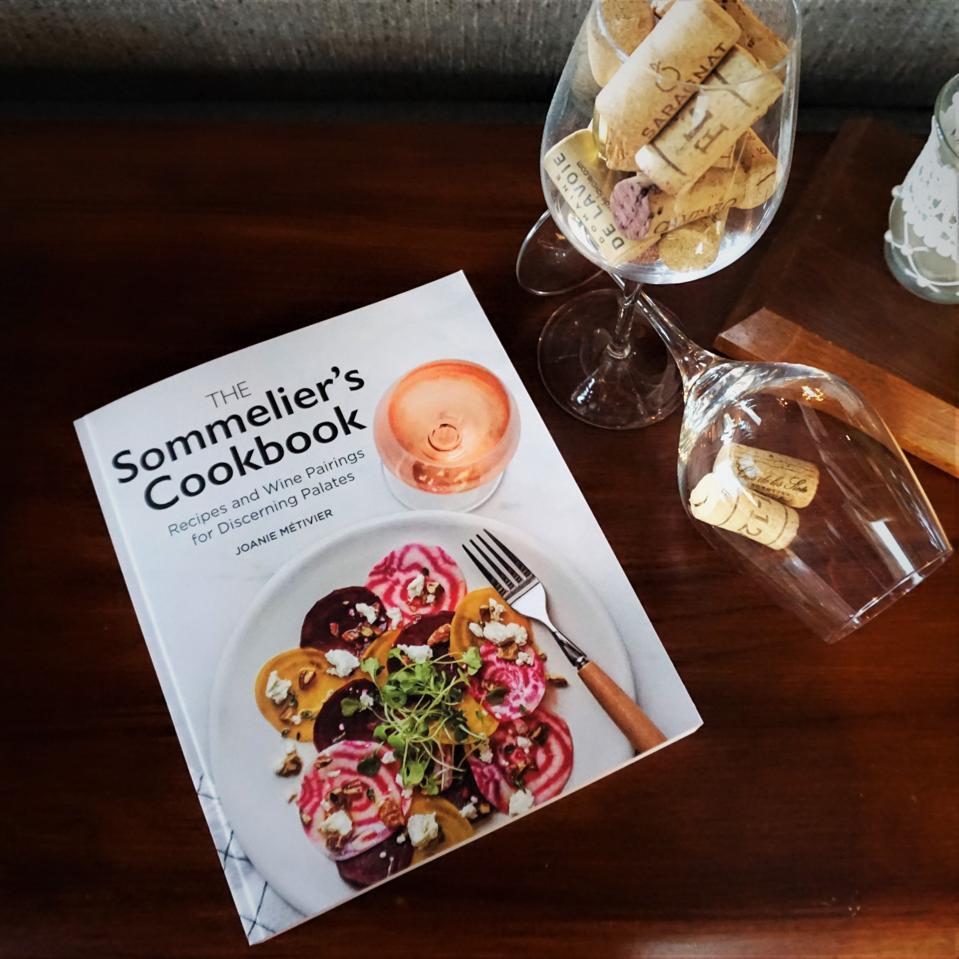 Picture of wine glasses and book with image of rose wine and plate of beets