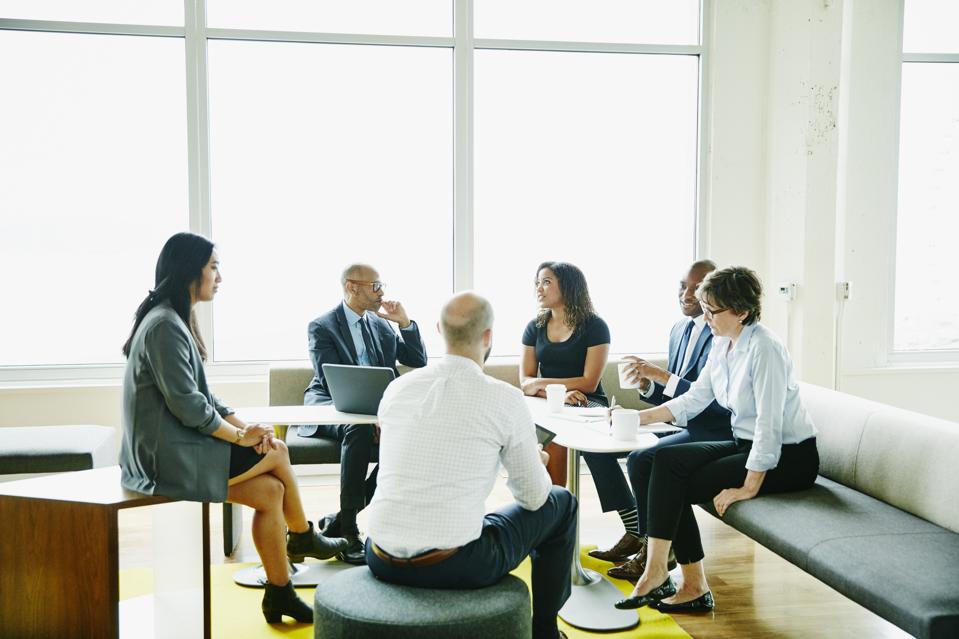 Businesspeople in discussion during meeting