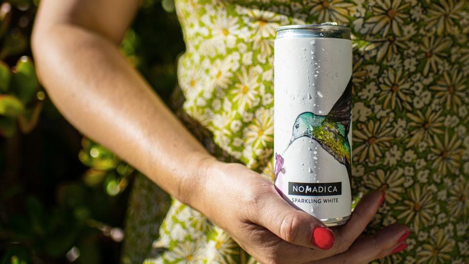 canned white wine from Nomadica with a bird on the label