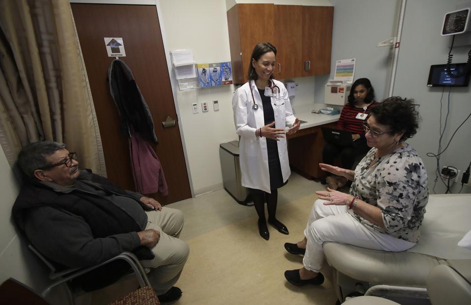 Dr. Megan Mahoney smiles after examining a patient at the Stanford Family Medicine office