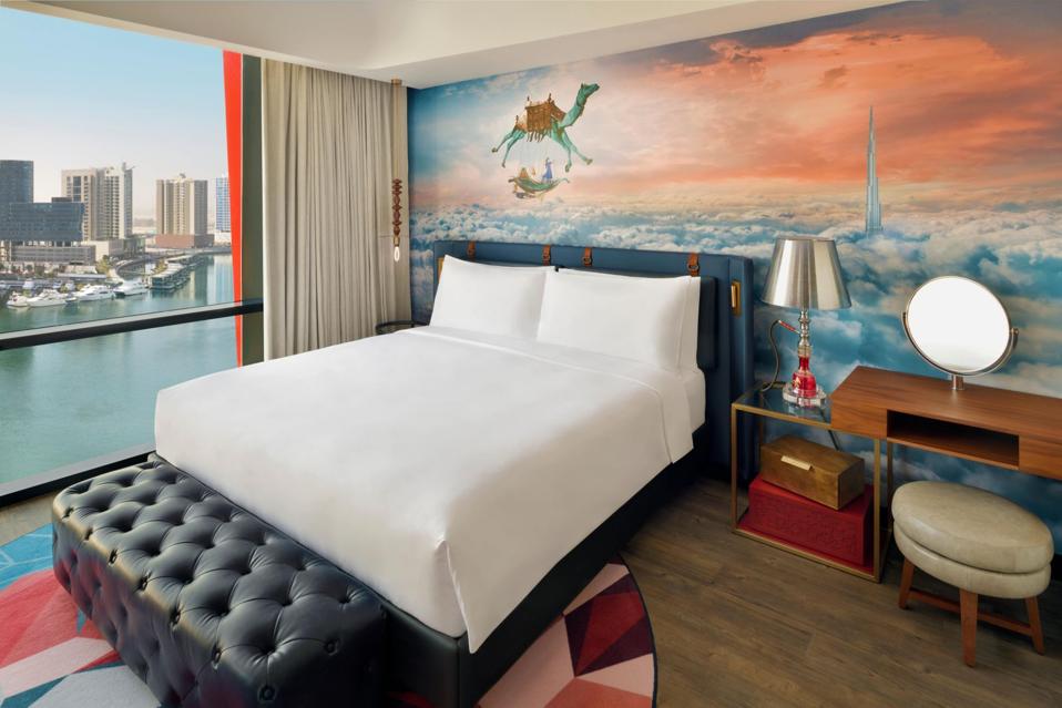 Hotel Indigo Room image with surrealist wallpaper and shisha style lamp