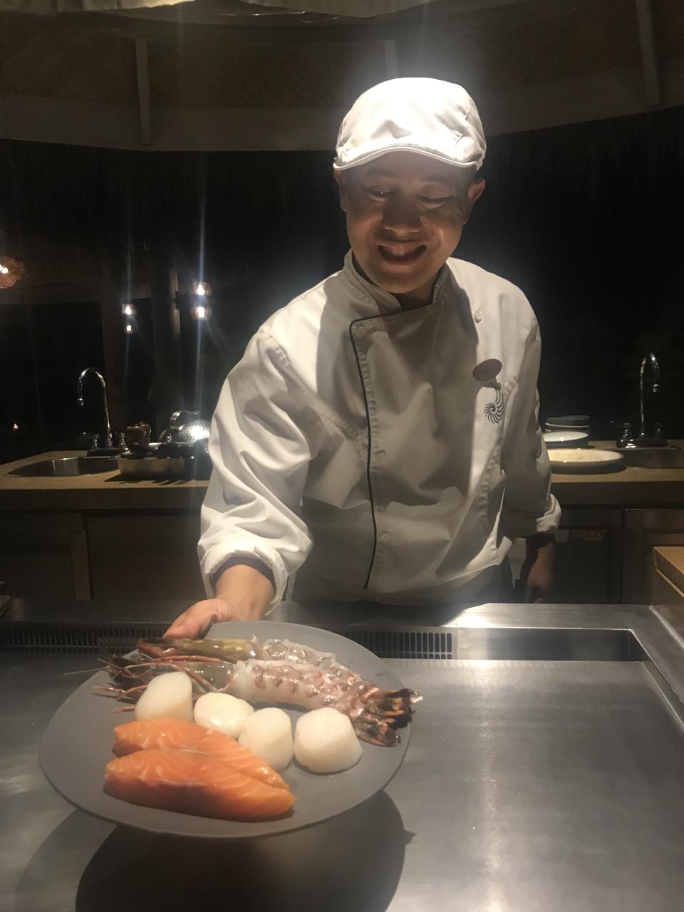 The chef at Ocaso restaurant at the Nautilus resort in the Maldives displays seafood