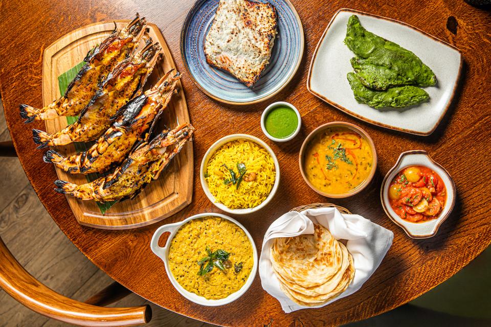 Indian seafood dishes on a table