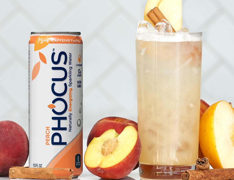 Can of Phocus sparkling water and cocktail glass