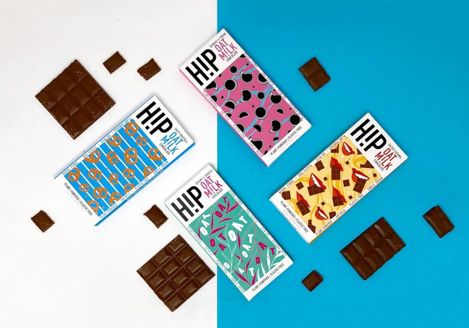 four chocolate bars in colorful packaging