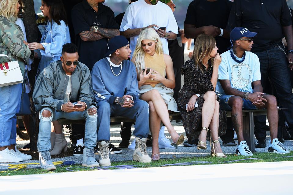 Kylie Jenner and her sister Kim Kardashian West at a fashion show in 2016 thrown by Kim's husband, the rapper Kanye West.