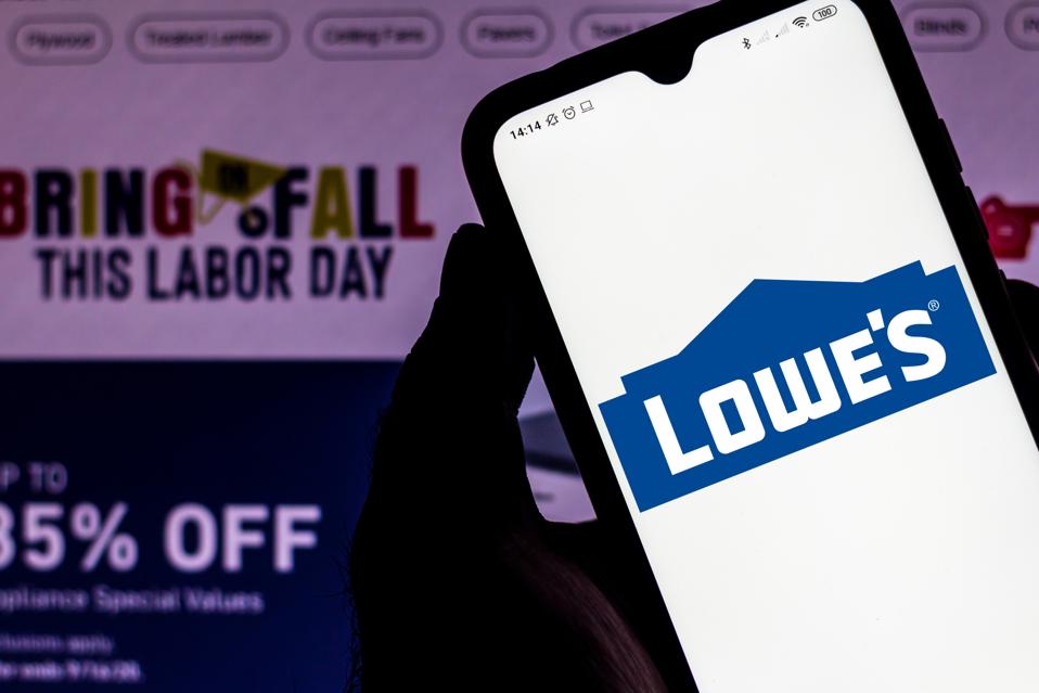 In this photo illustration the Lowe's Companies seen...