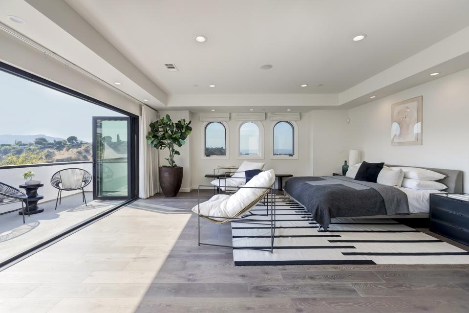 The primary bedroom in a luxury home.