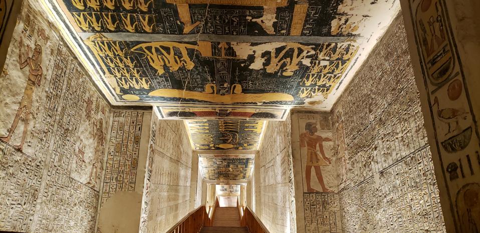Wall paintings and hieroglyphics within a tomb in Egypt's Valley of the Kings