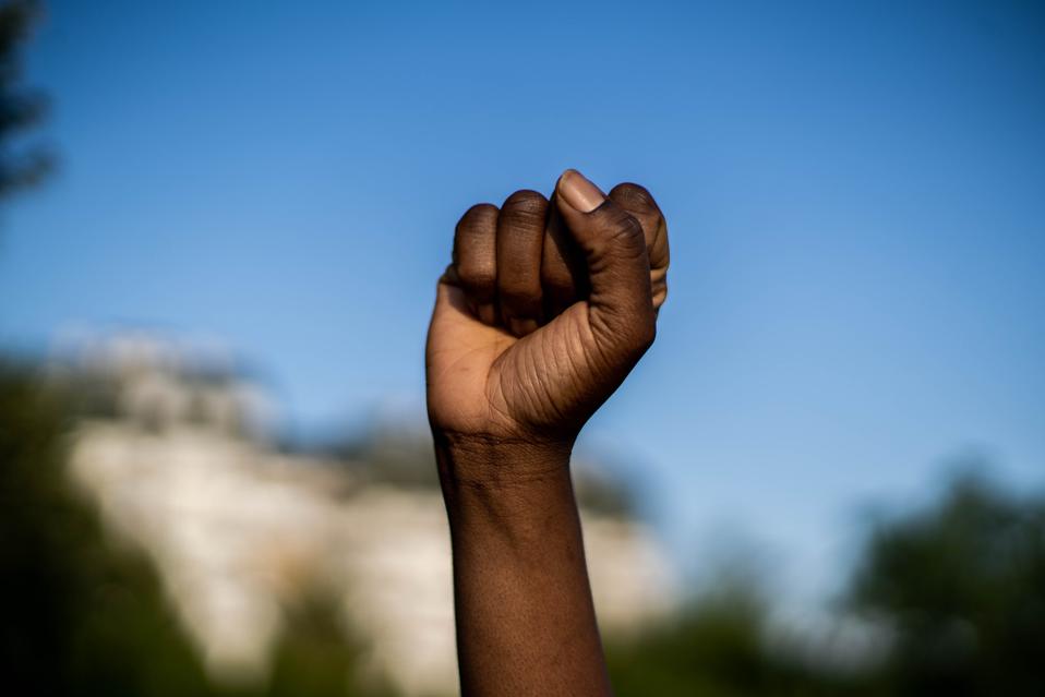 Raised fist in solidarity with Black Lives Matter.
