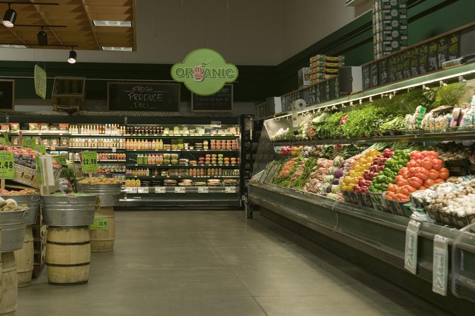Organic produce aisle in supermarket.