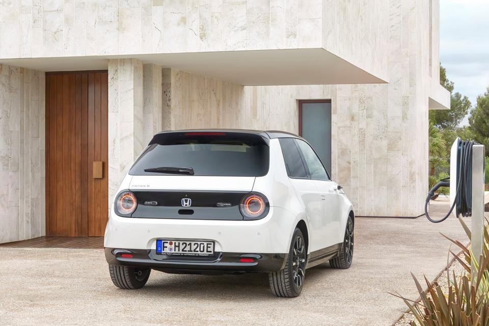 Rear view of a white Honda E electric car