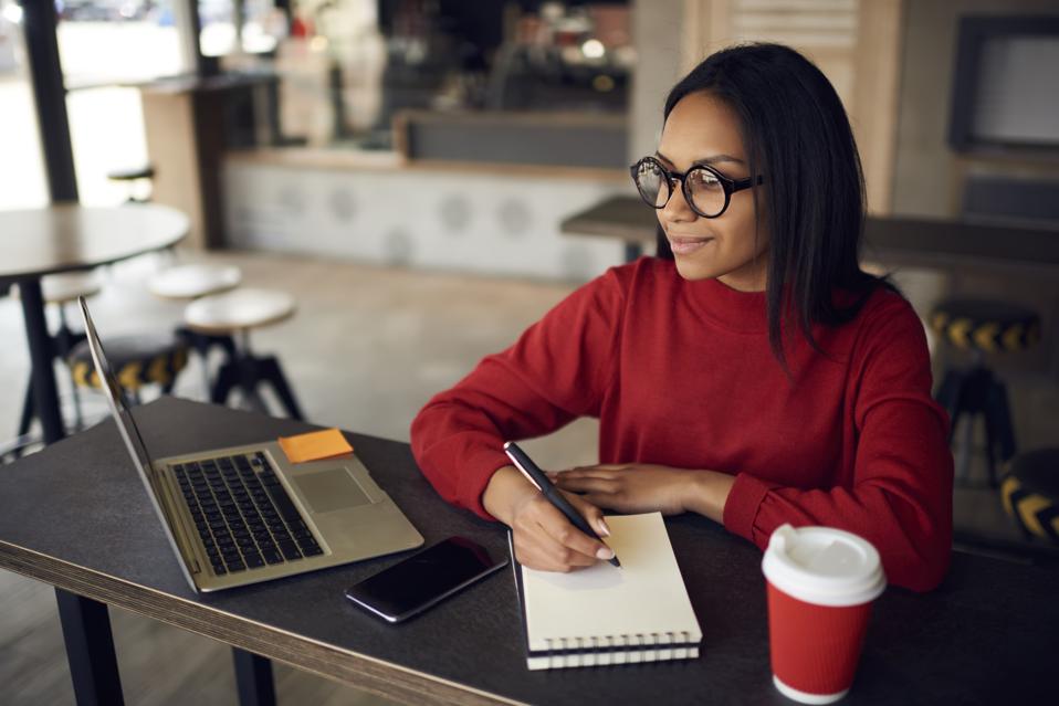 Writer jotting notes for her next post