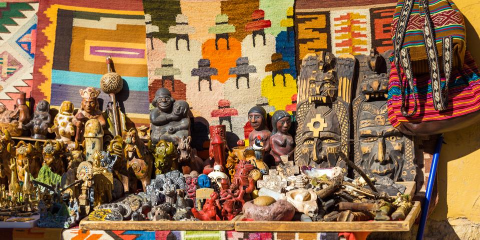 Wooden figurines for sale Ollantaytambo, Peru.