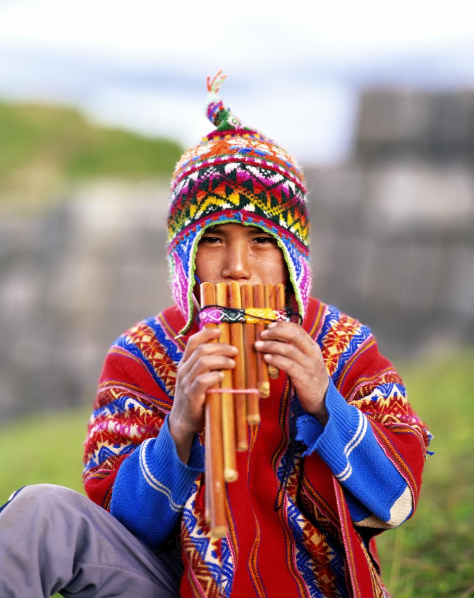 QUECHUA BOY PLAYING FLUTE, PERU