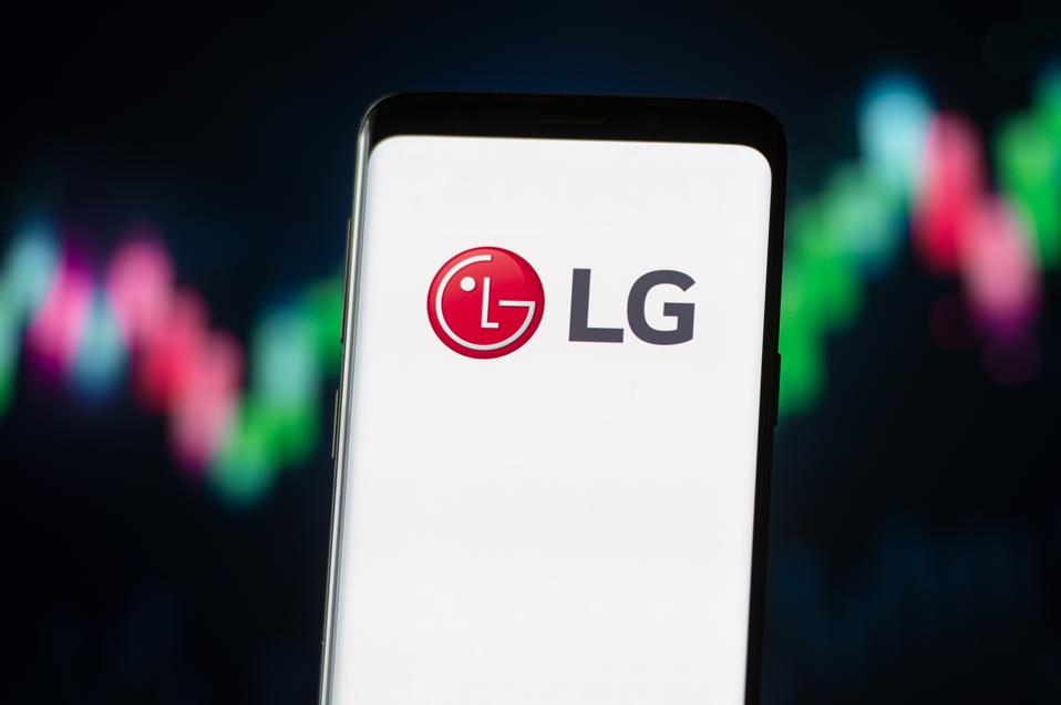 In this photo illustration a LG logo seen displayed on a...