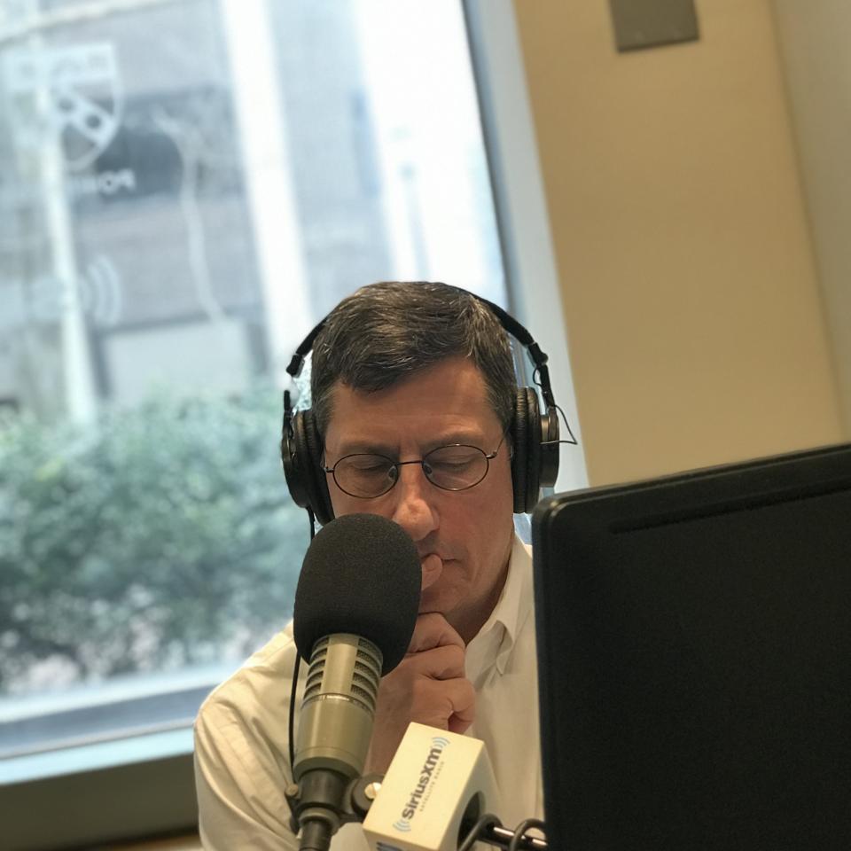 Loren Feldman recording a podcast episode in a Sirius radio studio.
