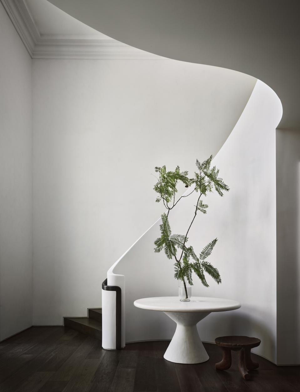 A sweeping, stark-white staircase.