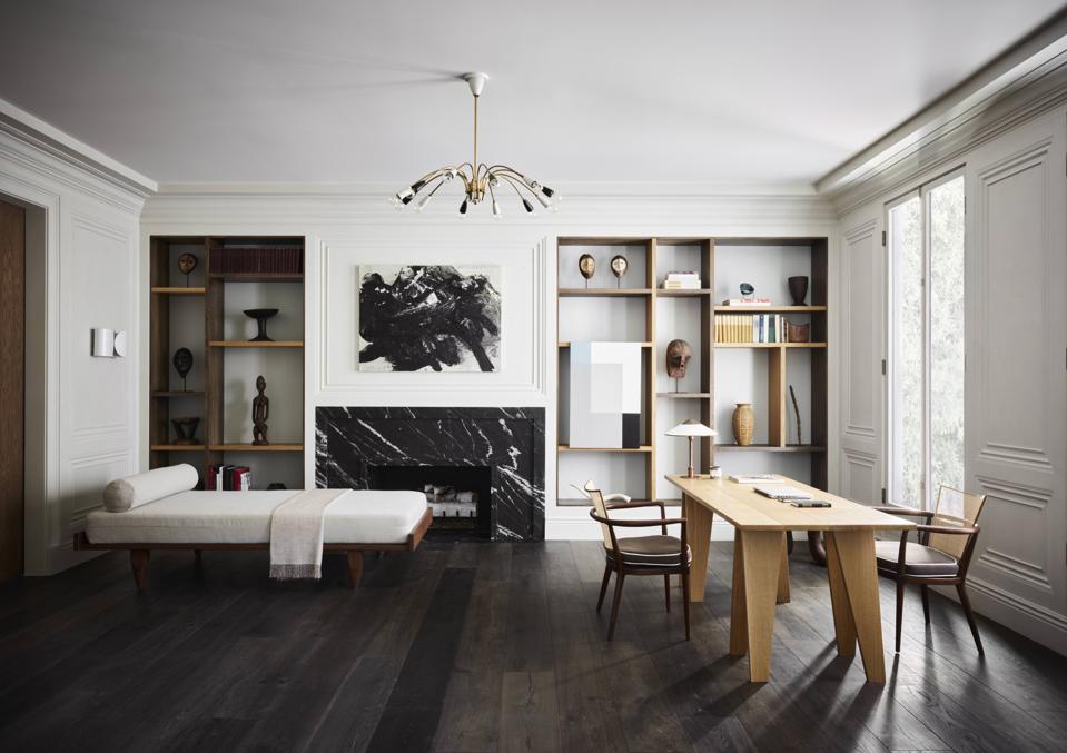 A library/office with a chaise and desk.