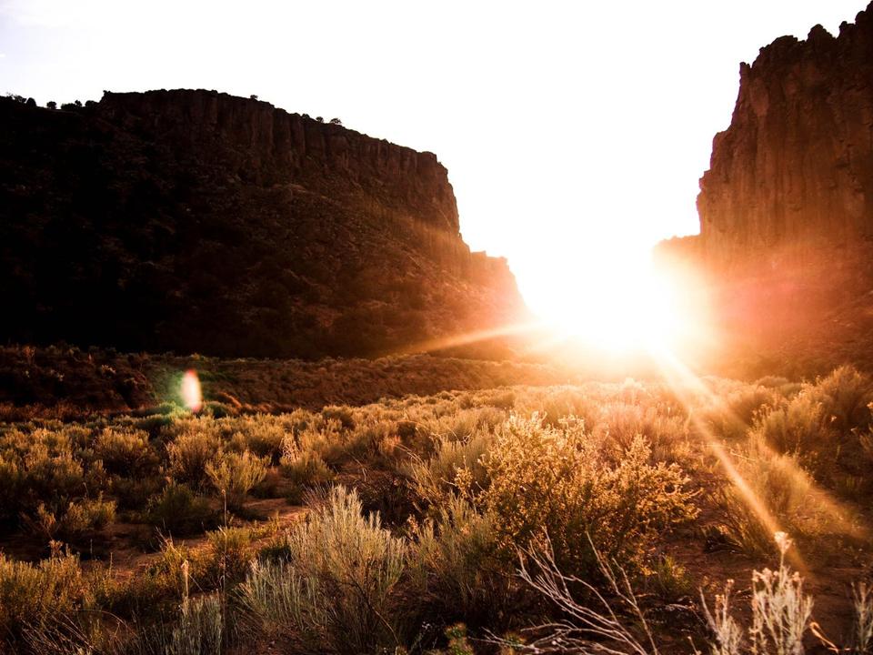 The sun is setting over Diablo Canyon in the mountains of New Mexico, USA