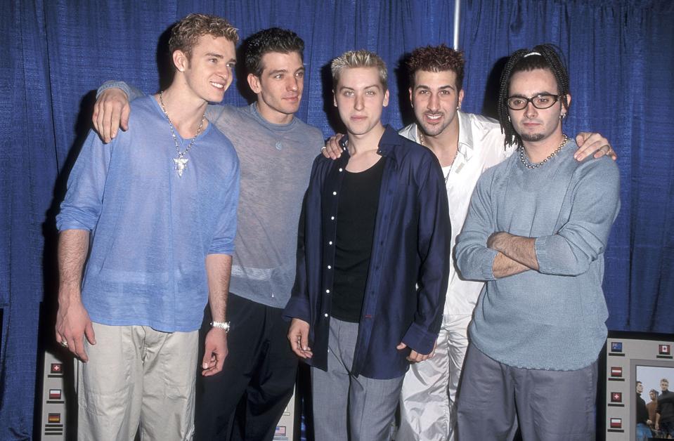 NSYNC celebrate backstage at their ″Ain't No Stoppin' Us Now″ Tour with a special plaque for one million record sales