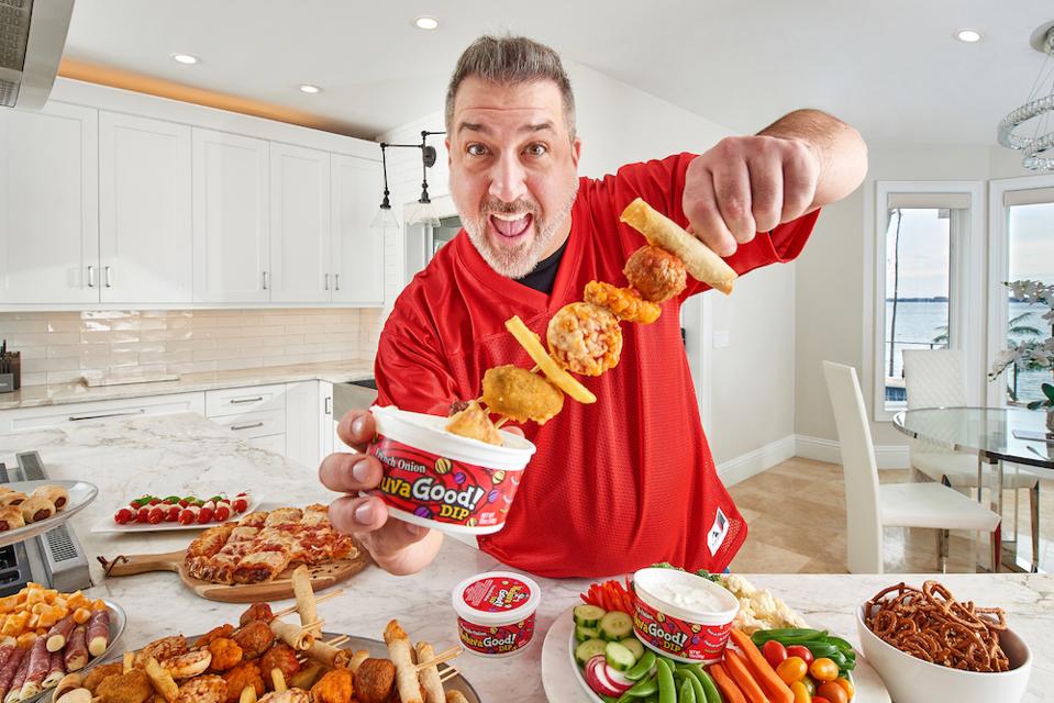 Man holding food and dip