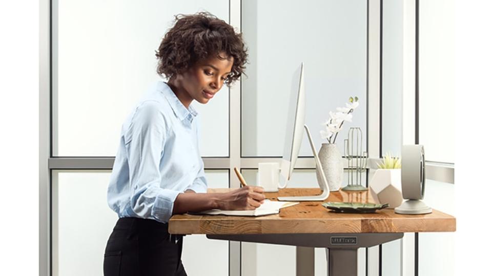 African American woman standing at desk