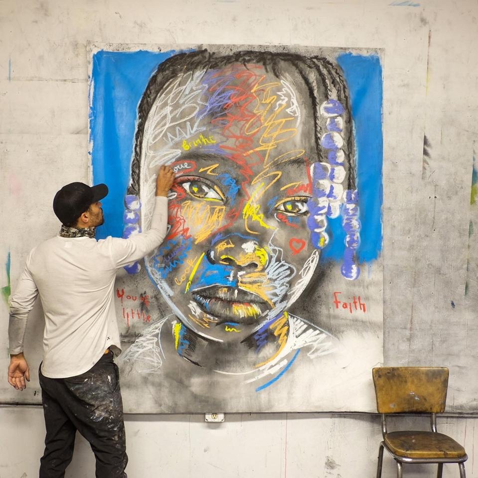 Micah Johnson working on a painting from his ″Black Sheep″ series and exhibition at Art Angeles Los Angeles.