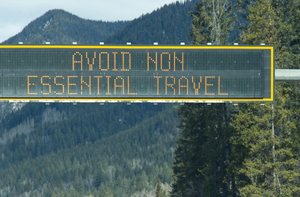 View of sign on Trans-Canada Highway ″Avoid non-essential travel″