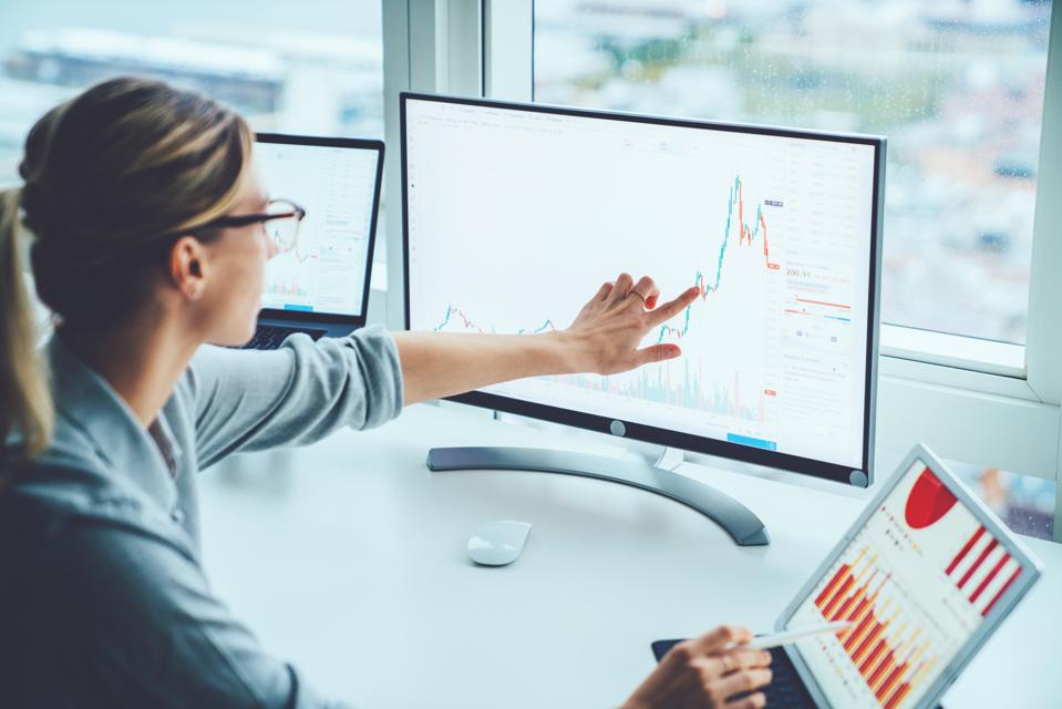 Business woman studying financial market