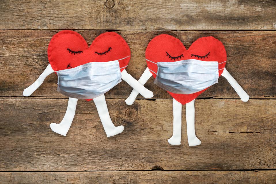 loving couple in medical masks on quarantine