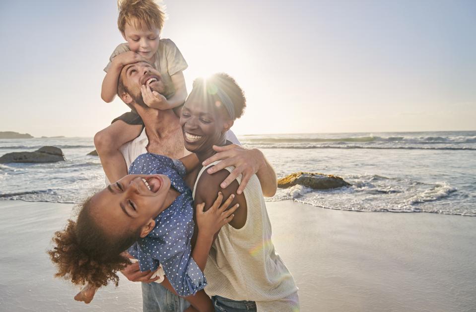 Family playing on beach