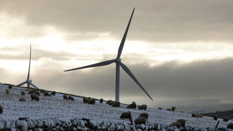 Wind Turbines Turn In Snow Covered Scottish Hills