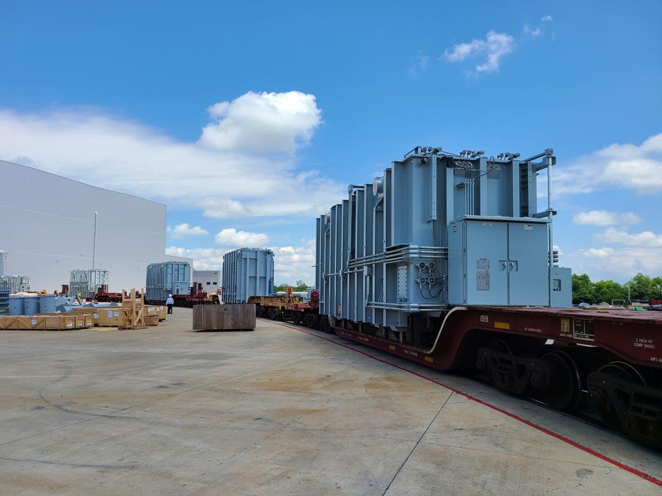 Transformers on a rail car for shipment after their construction at the Hyundai Power Transformers facility in Alabama.