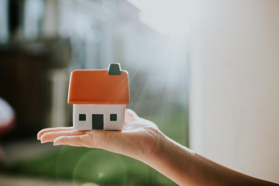 Hand holding House