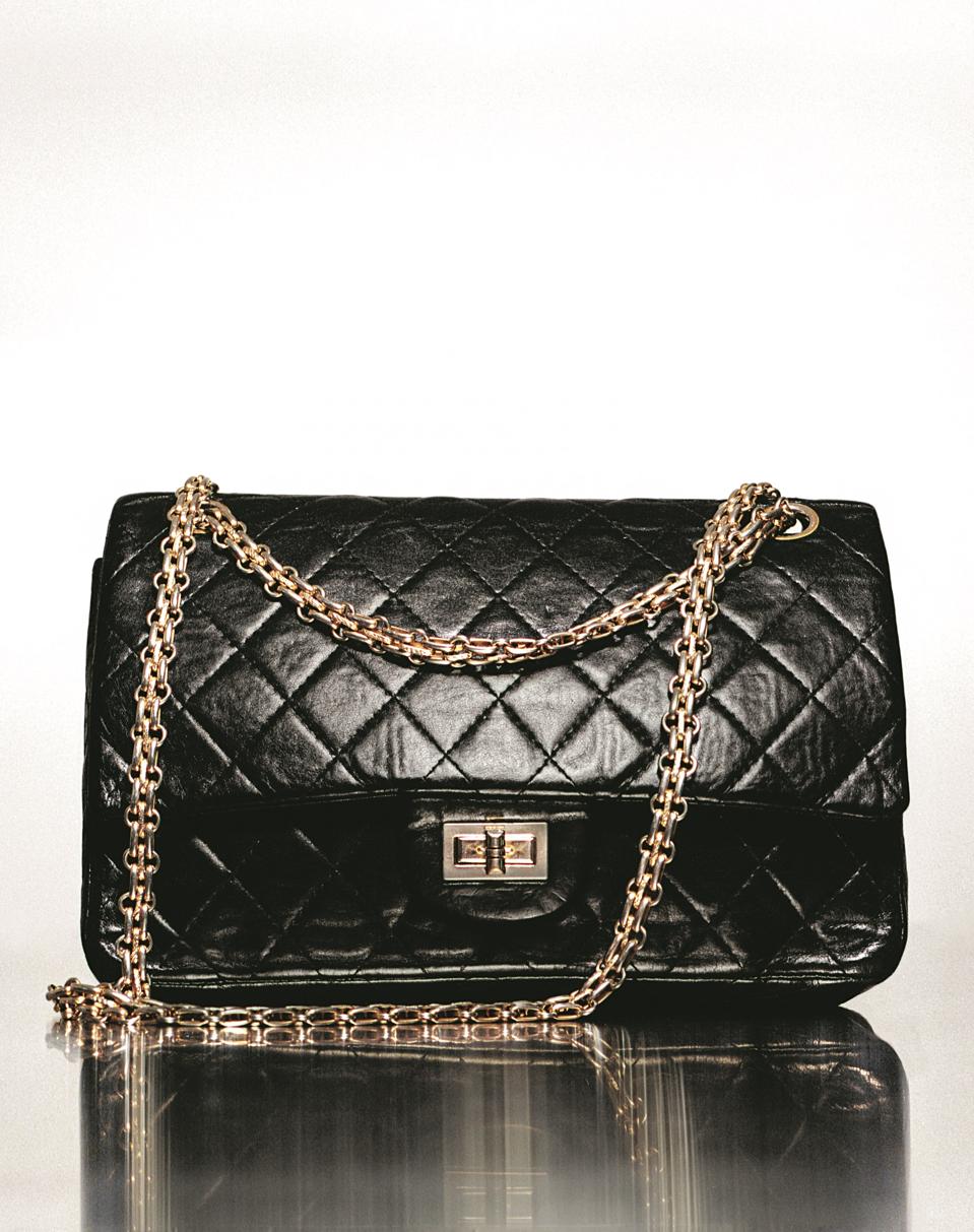 Chanel 2.55 Flap Bag in quilted, black-dyed sheepskin with gold-plated metal elements and a twist clasp, between 1955 and 1971. Paris, Chanel Heritage