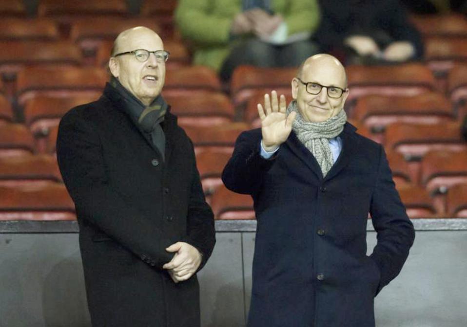 Avram, left, and Joel Glazer wait for play to begin before a Manchester United match in 2015.