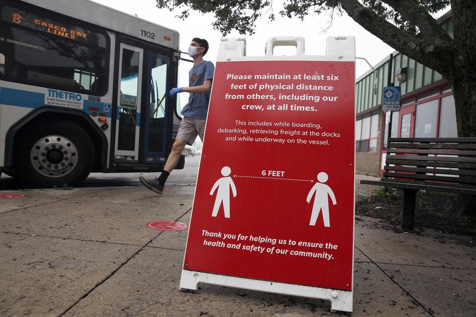 A sign at Casco Bay Lines informs passengers to maintain 6 feet distance from fellow passengers in Portland, Maine