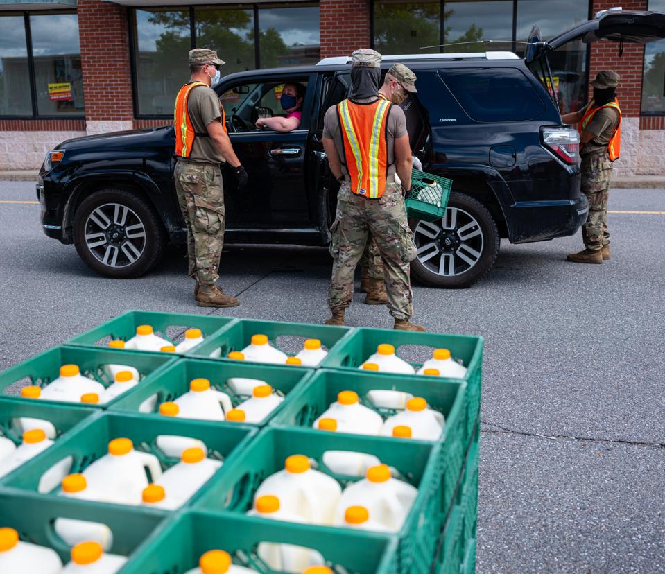 Members of the Vermont National Guard distribute food to needy families during Covid-19