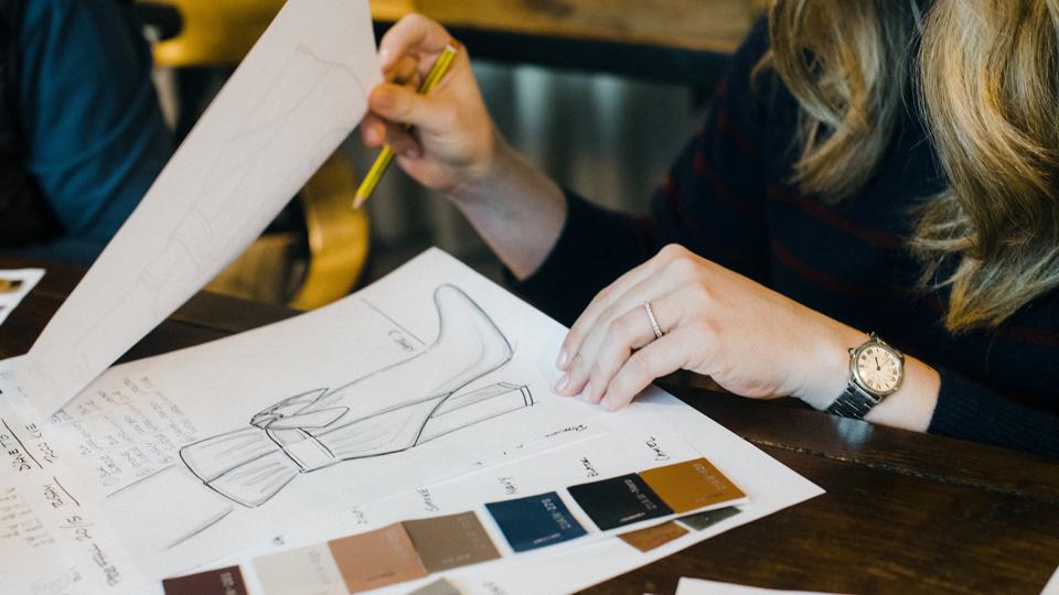 Marion Parke, founder of Marion Parke, approving shoes sketches.